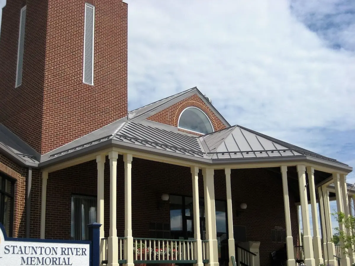 Skilled roofing craftsmen working on a residential roof in Towson